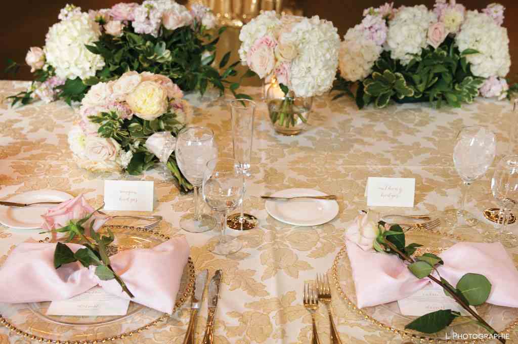 The table is decorated in shades of light pink, light yellow and cream white.